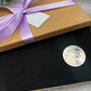 Surprise holiday gifting set including, scratch card, box & birthday coin.